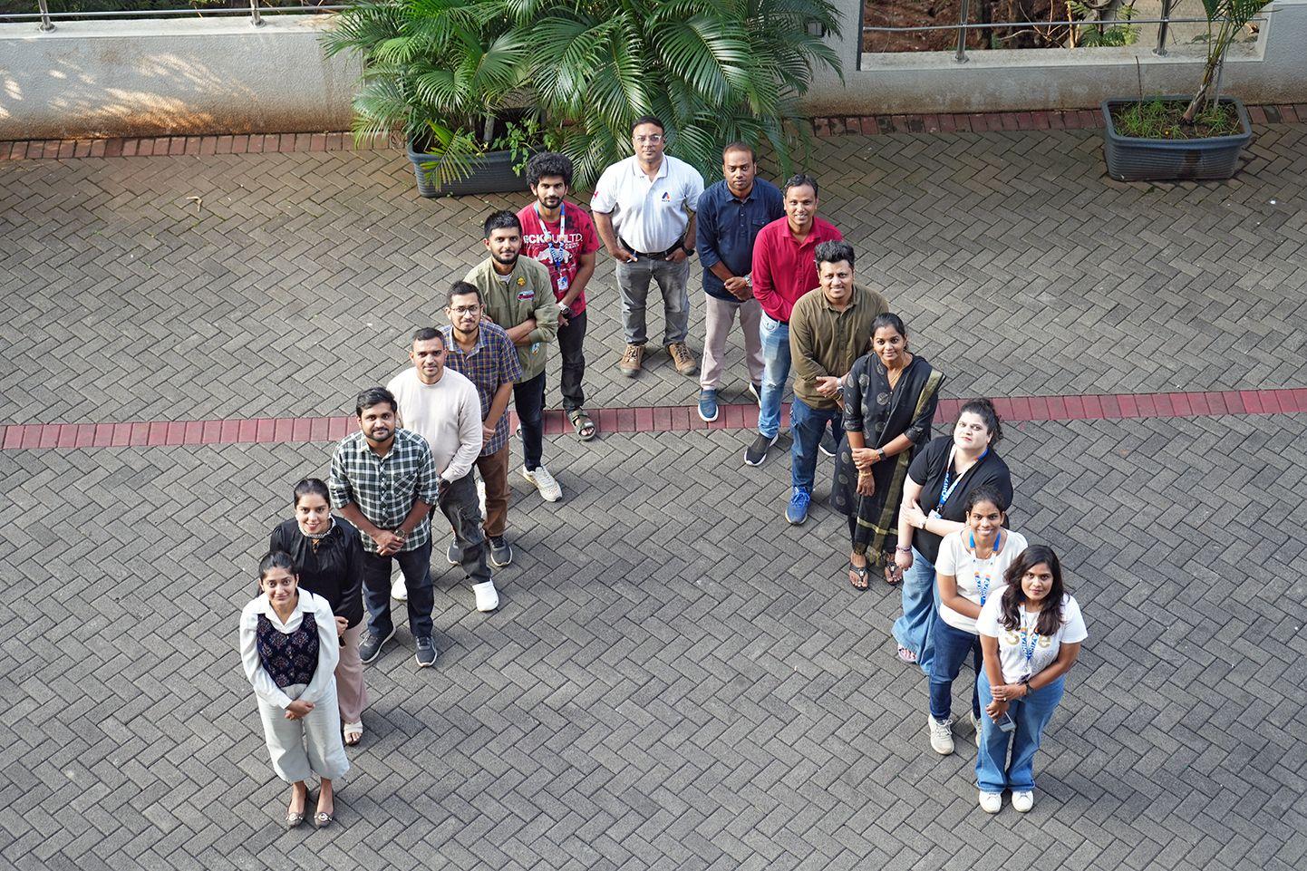 Aziro Team Recreating Aziro Logo